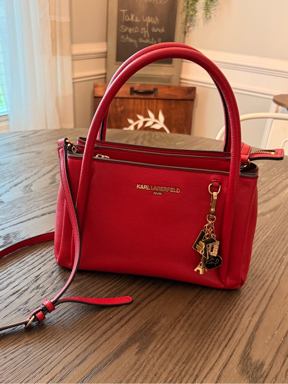 Red Karl Lagerfeld Paris Nouvelle satchel w/ a dangling Eiffel Tower charm.